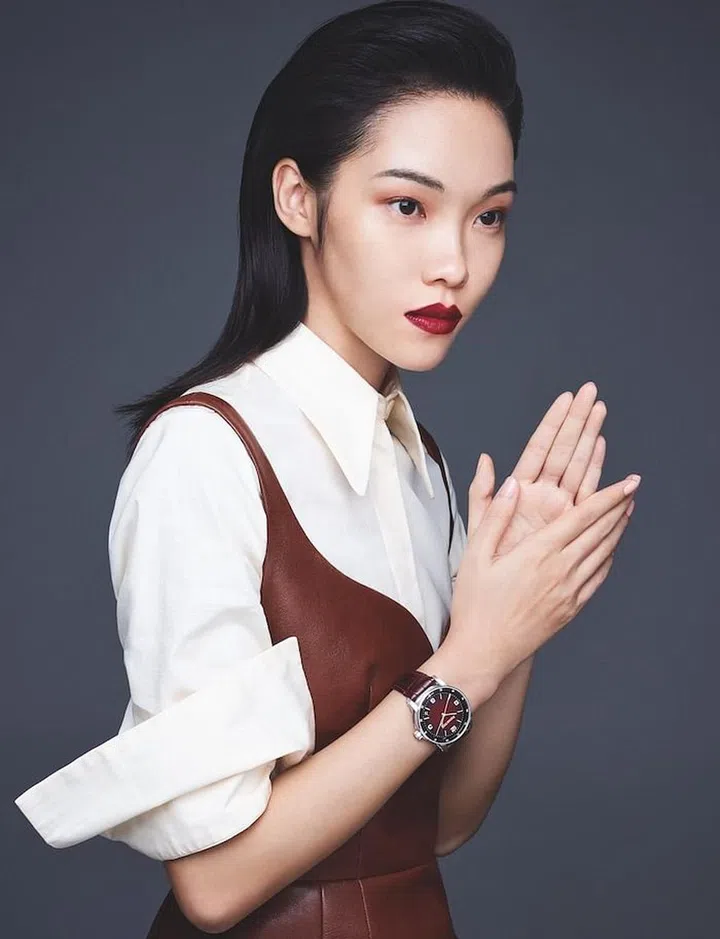 White gold CODE 11.59 by Audemars Piguet Selfwinding watch. Bustier dress; shirt, Tod’s 

