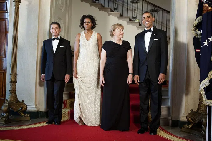 The Obamas pose with German Chancellor Angela Merkel and her husband, Joachim Sauer.