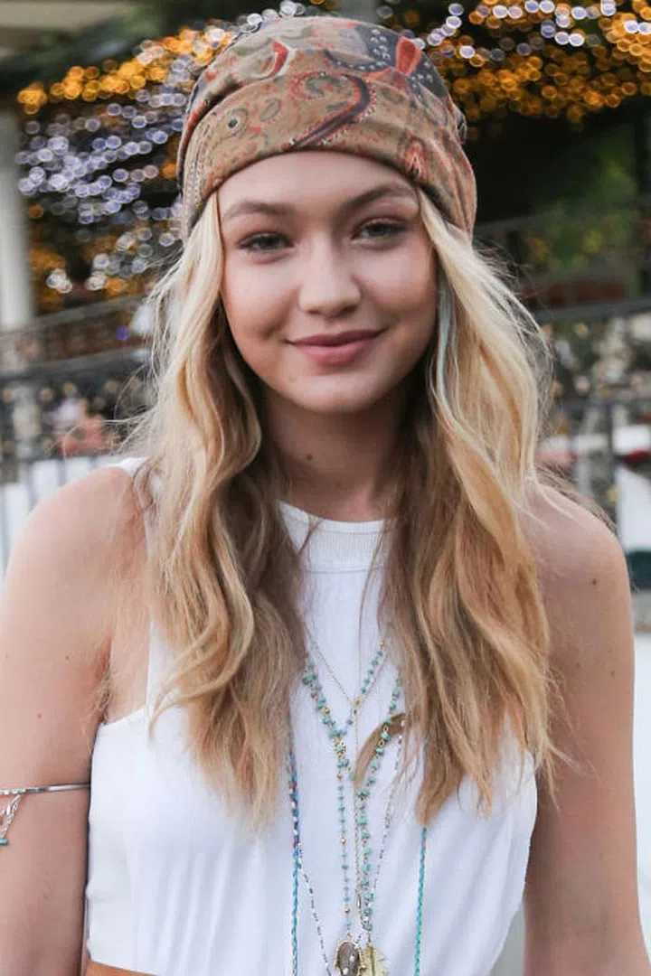 If we didn't already tell you this was at Coachella, we bet your first guess would have been...Coachella. The paisley-print headscarf and undone waves are music festival staples. Photo: Getty