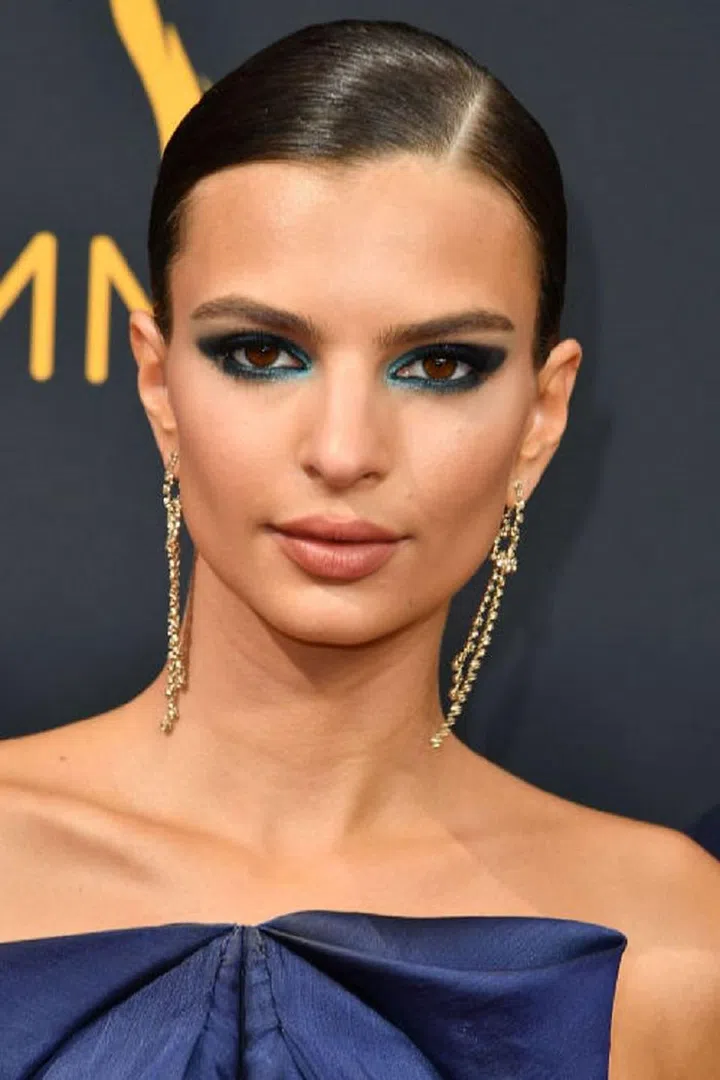 Brown is the most neutral eye color, which means the bolder the makeup color, the better the contrast. Cobalt and navy blues are a favorite of Wilson's because "they tend to bring out the reddish tones that are normally hidden in brown eyes," he says. Try dusting a deep blue on the lid stopping at the crease for day, or intensify it with a dramatic navy smoky eye for night. To keep it from looking "too strong," he adds, "I normally place a golden color to highlight the inner corner of the eye and use tons of mascara." Photo: Getty 