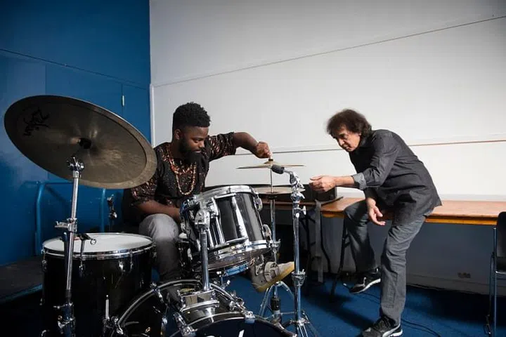 Marcus Gilmore demonstrates his work to his mentor Zakir Hussain. Photo: Courtesy