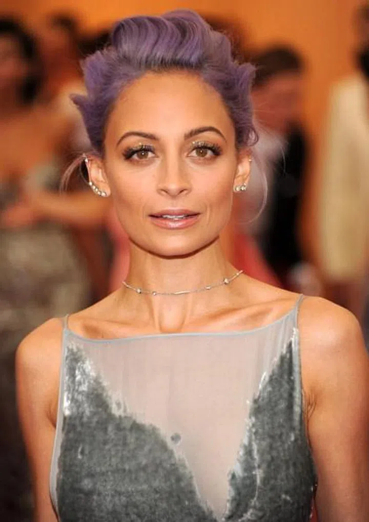 Nicole was raised in California by music legend Lionel Richie and his then-wife Brenda. Nicole's biological parents are often said to be friends of the couple and a one-time bandmate of Lionel, but it's  never been confirmed. She was legally adopted at age nine, and had another music icon play a role in her childhood; her godfather was Micheal Jackson. 