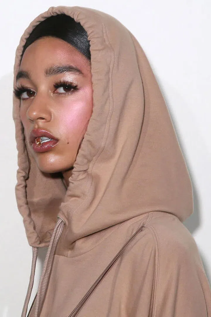 The beauty look at Fenty Puma relied on only two things: serious false eyelashes, and an intense pink cheek highlight. On the cheeks, makeup artists applied a bold sweep of Marc Jacobs Beauty Air Blush Soft Glow in Lush and Libido all the way up to the cheek and toward the temples. Then the Marc Jacobs Beauty Glistening Illuminator, a pearly cream highlighter, was rolled across the temples. The effect was an intense pop of pink shimmer, but in this day and age, there's no such thing as too much highlighter. 