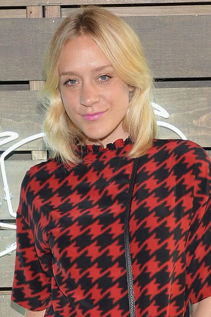 No bangs, no problem: Just part your layered bob down the center and add some loose waves.
