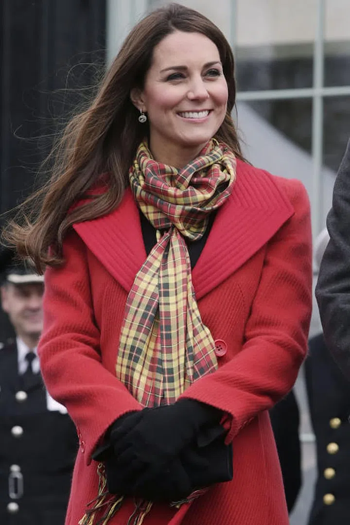 Will and Kate also have their own tartan. Since their Scottish titles are the Earl and Countess of Strathearn, Kate has accessorised several outfits with this yellow and red Strathearn tartan scarf.