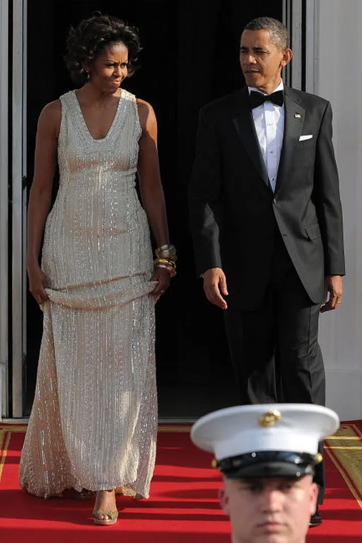 The entire dress was covered in silver beads, white sequins, and metallic thread to give it a multi-dimensional sparkle.