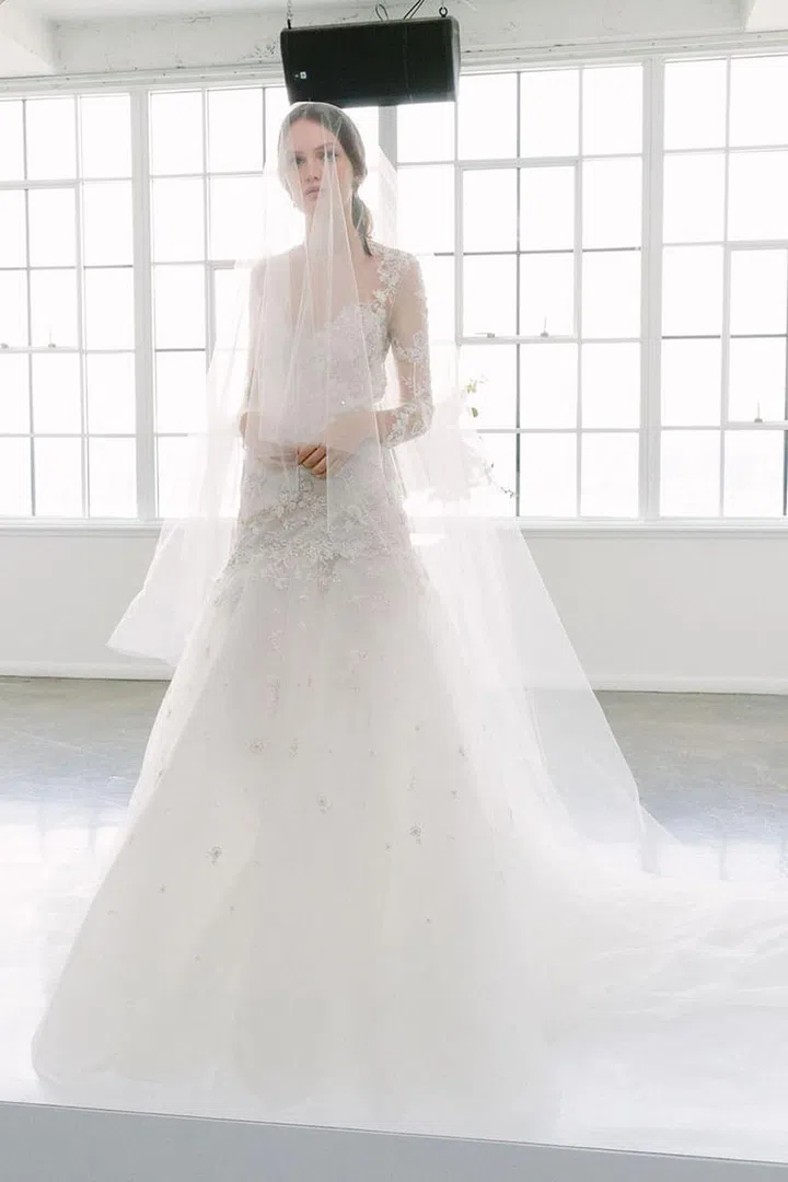 Fit-and-flare shapes need soft fabrications to work for rustic settings, and rich embroidery only works when its layered and textural rather than over-the-top and overly glitzy. Marchesa gown, marchesa.com. 