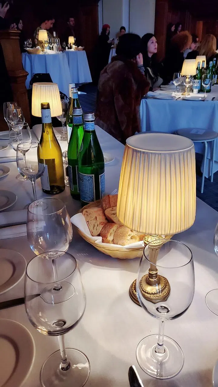 Molly Goddard played hostess with the mostest, seating guests at her show at long dining tables stocked up with bread and water.