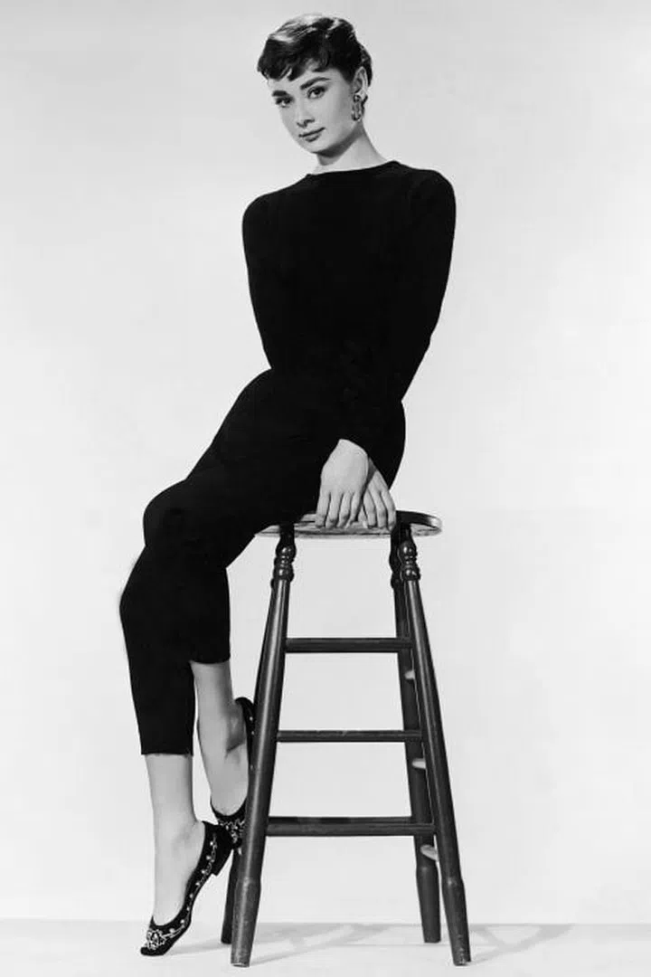 The chic actress was a major fashion influencer—particularly when she partnered with Hubert de Givenchy and Edith Head for films like Funny Face and Sabrina. She popularized straight, black-cropped pants, boatneck tops, and comfortable slip-on loafers designed by none other than Ferragamo. She made Holly Golightly an icon in the film Breakfast at Tiffany's, a fashion favorite forever.