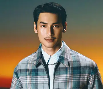 Apo Nattawin Wattanagitiphat in Dior jacket and trousers by Waroon Kieattisin Harper’s BAZAAR Singapore November 2024