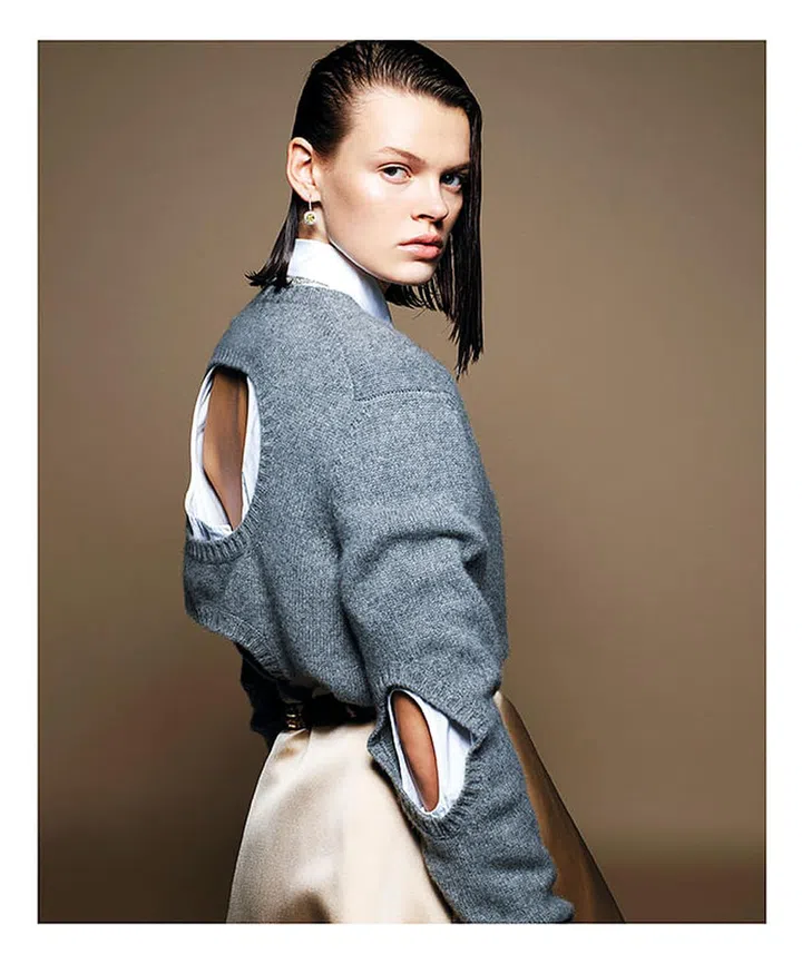 Prada sweater, shirt, skirt, and belt; Tiffany & Co. earrings and necklace