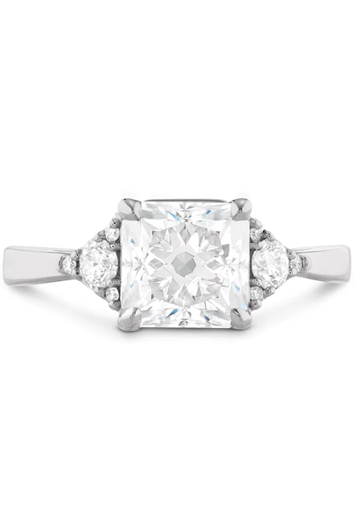 Your ring has: A large square diamond

You are: Confident and proud. "Your ring no doubt says, 'I got a rock,'" Sabatino says. That big, gorgeous statement piece is a reflection of your glam, Old Hollywood style. You love making an entrance and enjoy being the life of the party.

Hearts on Fire Triplicity Dream Engagement Ring, heartsonfire.com.

Photo: COURTESY OF HEARTS ON FIRE