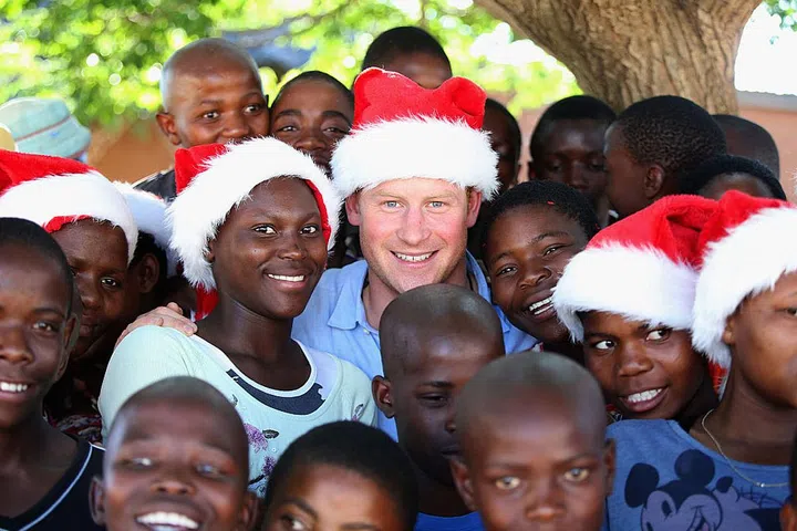 They travel near and far to deliver messages of goodwill. In this photo from 2014, Prince Harry visits Lesotho to see the work of his charity Santebale, which provides healthcare and education to children in the region. Prince Harry co-founded the charity with Prince Seeiso in 2006.
