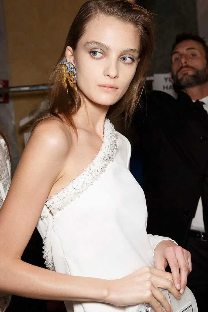 At Genny, volume at the roots gave hair the lift it needed to be tossed back and over to the side. 