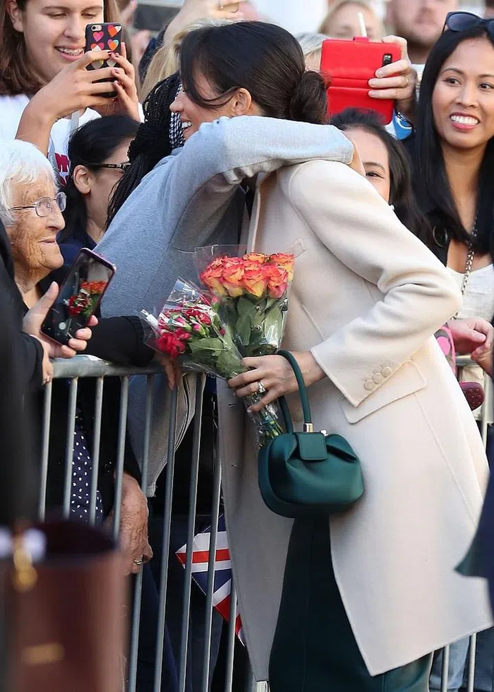 One fan leaned in to give Meghan an enthusiastic hug.