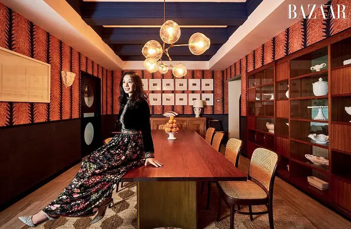 Long perched on the dining table in a R&K Originals velvet dress and Ann Taylor heels.