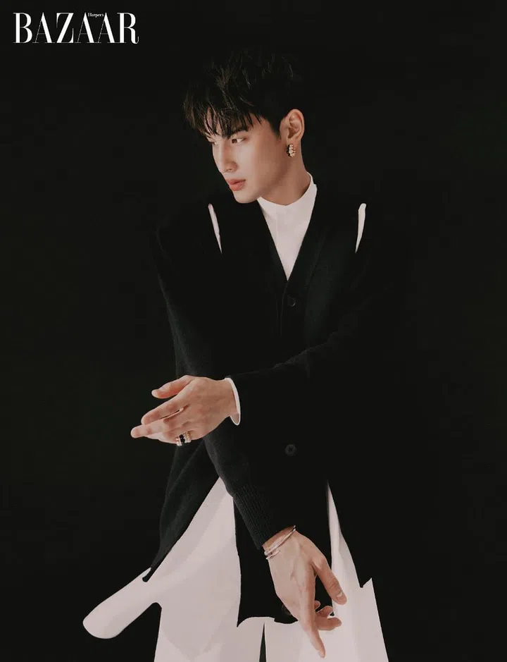 Cardigan; shirt, trousers, Alexander McQueen. Earring; rings; bangle, Cartier.