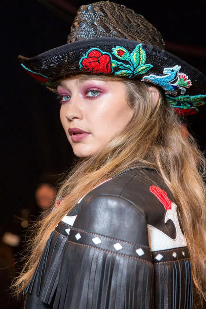 Pink makeup was a sleeper hit at fashion week, popping up at a few shows here or there without really making a splash. It wasn't until the Anna Sui show at the end of the week that the trend really found its footing. The look was all about a rebellious take on Americana. Makeup artist Pat McGrath translated that into a wash of rich burgundy color across the eyes, swept around both the top and bottom lids. A similar color was done in a glossy finish on the lips.