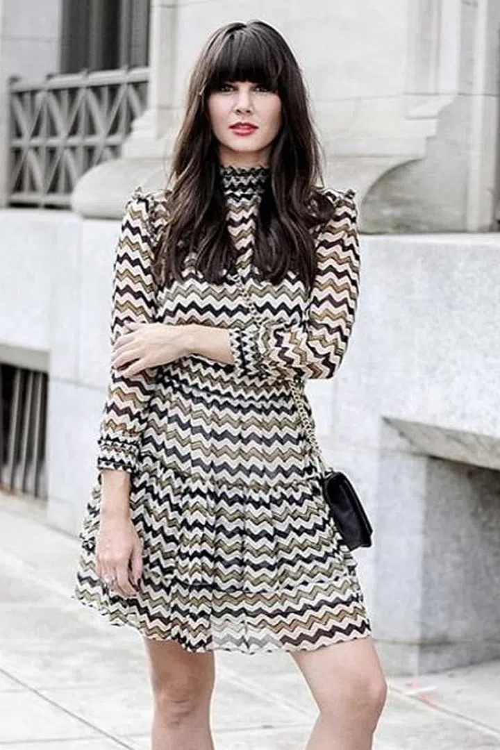 It's been said that when you have bangs, you're never without a hairstyle. Styled sleek but bouncy, blogger Marianne Verrilli's hair is giving us major '60s vibes. Photo: Instagram @maverrilli