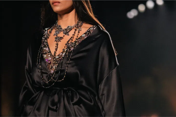 Model wearing a Chanel satin dress