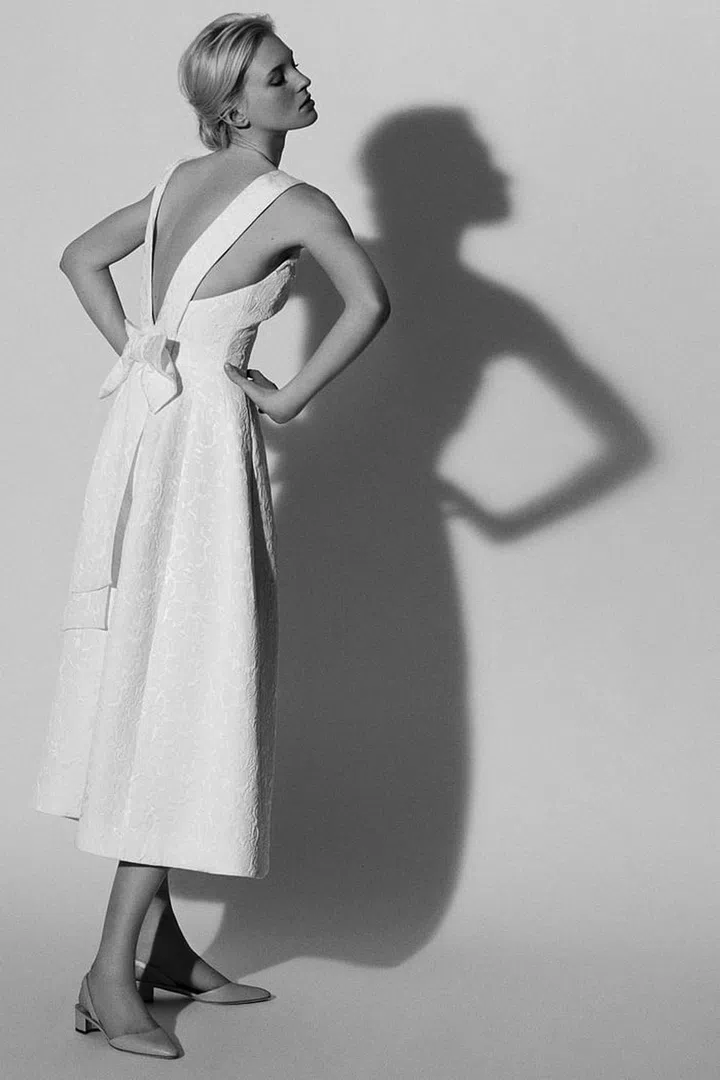 For farm nuptials that don't take themselves too seriously, opt for classic fabrications, ladylike details and a shorter hemline. Carolina Herrera Bridal Spring 2018 Look 7, carolinaherrera.com. 