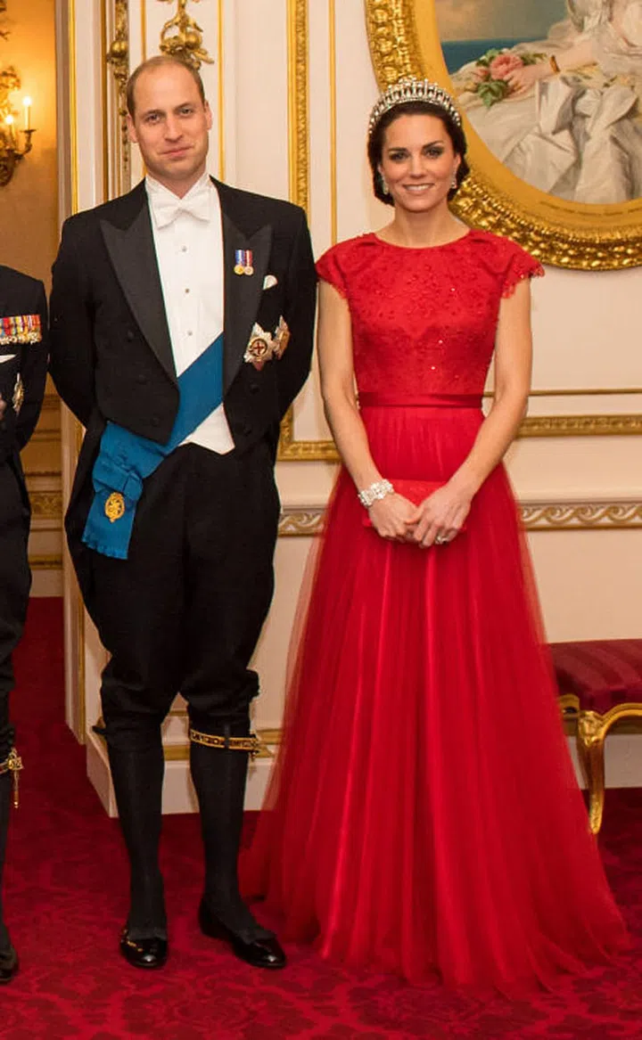 At the Annual Diplomatic Reception held at Buckingham Palace, the Duchess accessorized her ruby-red Jenny Packham gown with the Cambridge Lover's Knot Tiara—a favorite of Princess Diana.
