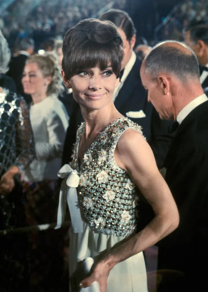 A glamorous beaded shift dress - proving she had more than just a closet of LBDs.