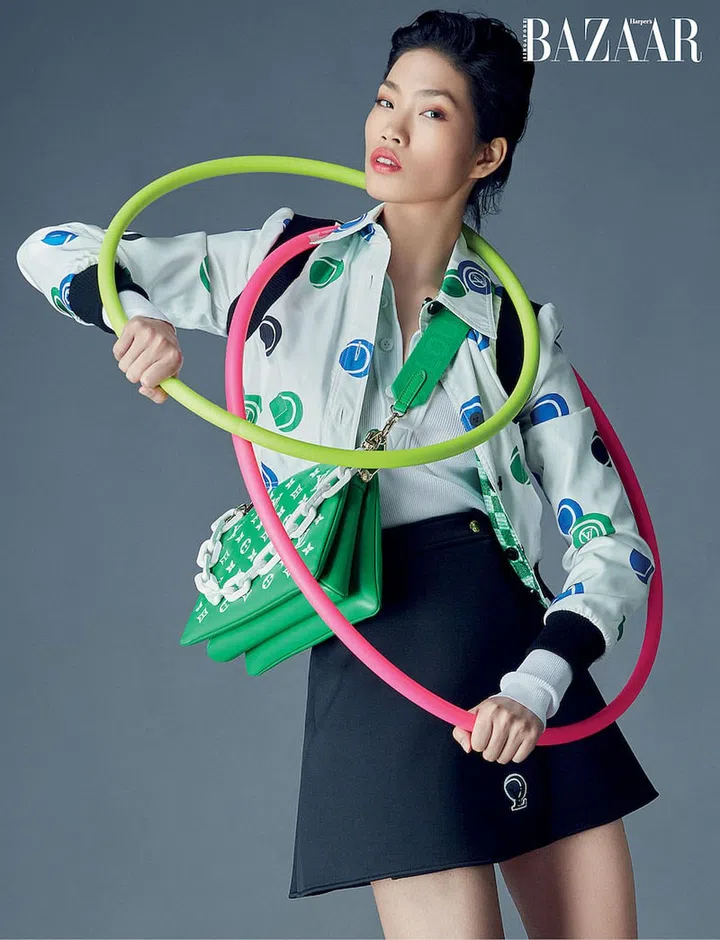 Polyester puffer jacket; polyamide‐blend polo shirt; polyester‐blend tennis skirt, all from Louis Vuitton. (Photo: Gan)