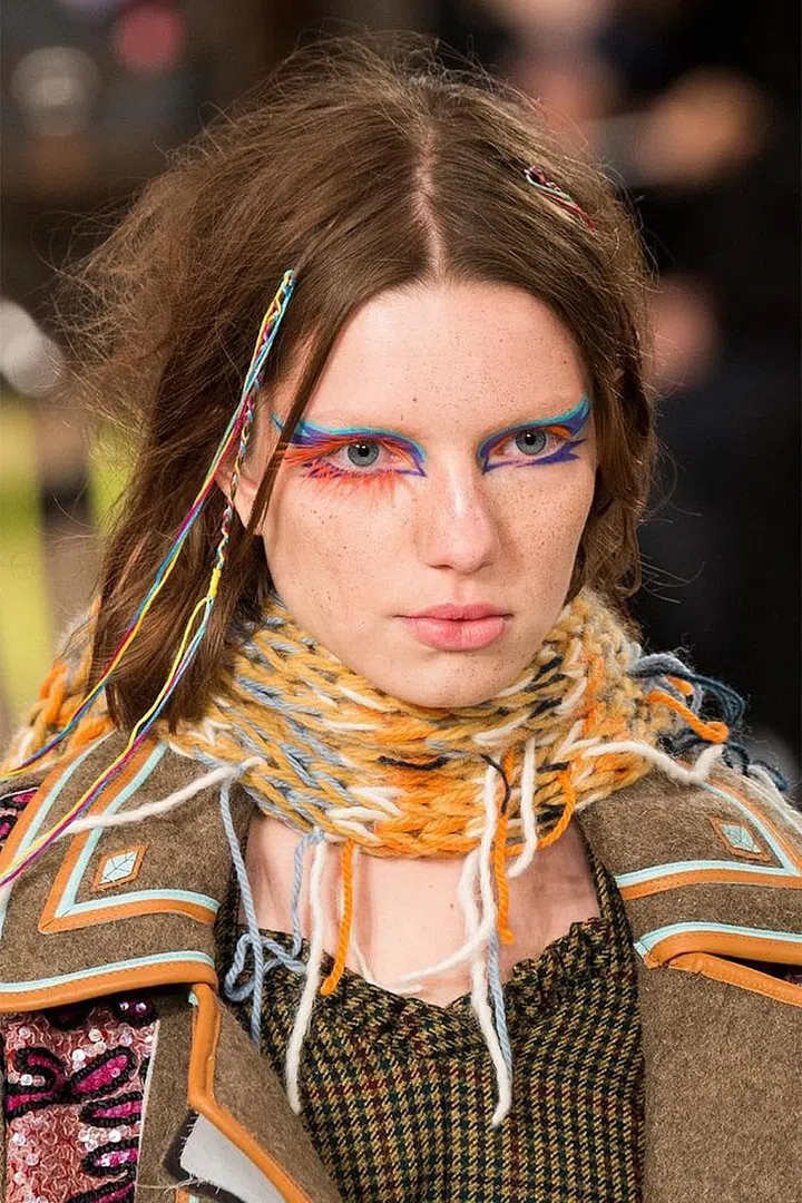 It was all about a sweet, Victorian innocence backstage at Altuzarra. Hairstylist Odile Gilbert pulled the hair back into a low ponytail, which served as the perfect canvas for the custom headbands. 