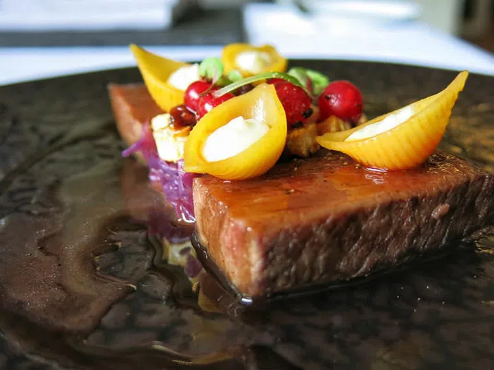 Mouthwatering serving of roast venison spiced with fragrant juniper berries and served with crunchy summer greens. . Photo: Lewin Terrace