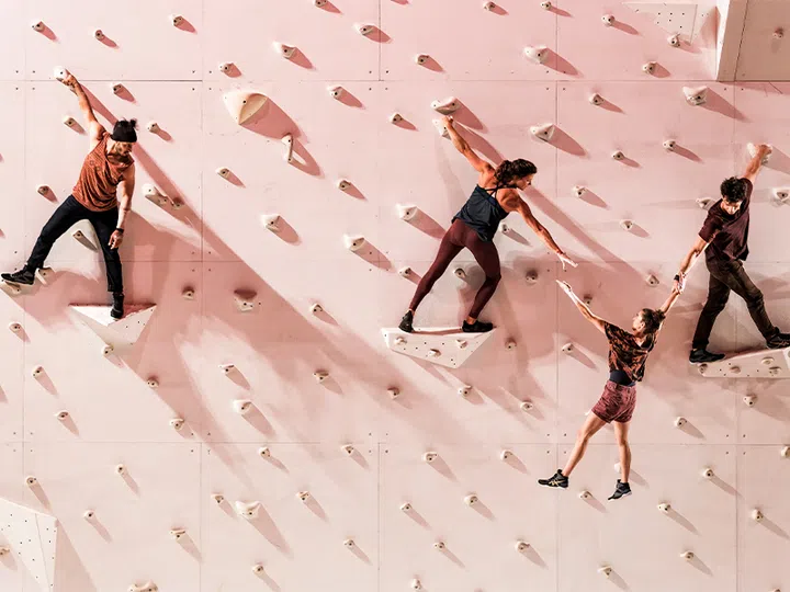 corp extremes acrobats performing routine on a rock wall at esplanade singapore