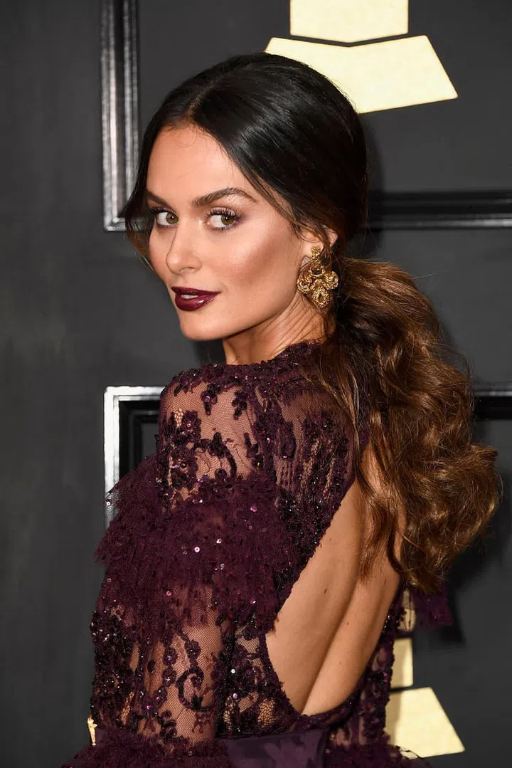 The Australian model's sculpted cheekbones and burgundy lips are our inspiration for a sexy night out. 

Photo: Getty Images