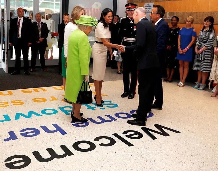 The Queen and Markle greet their hosts at Storyhouse. Photo: Getty