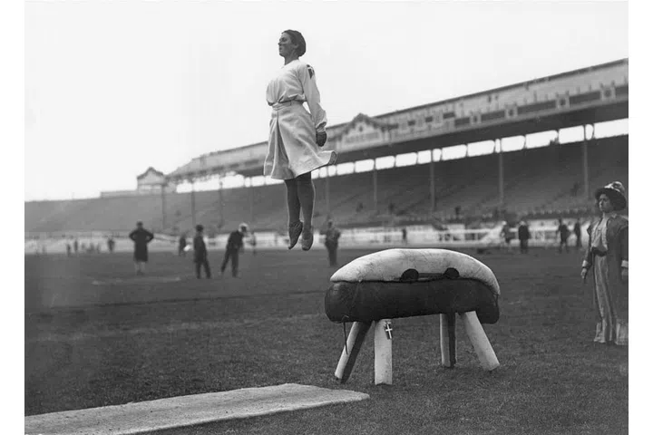 A Danish gymnast flying off the pommel horse during practice in London. Photo: Getty