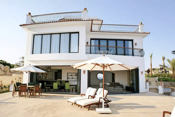 Azure waters and excellent diving make Sharm El Sheikh a gorgeous Egyptian beach town. A Spanish-inspired beachside villa is the way to go, complete with an infinity pool and modern interiors. Photo: Airbnb