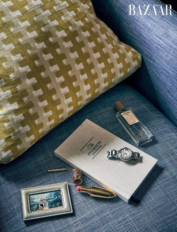 Surrounding Long’s daily journal, upon which sits a Cartier watch gifted to her by her husband for her graduation 10 years ago, are a LOEWE scent, a The History of Whoo lipstick and an old picture of the young couple.