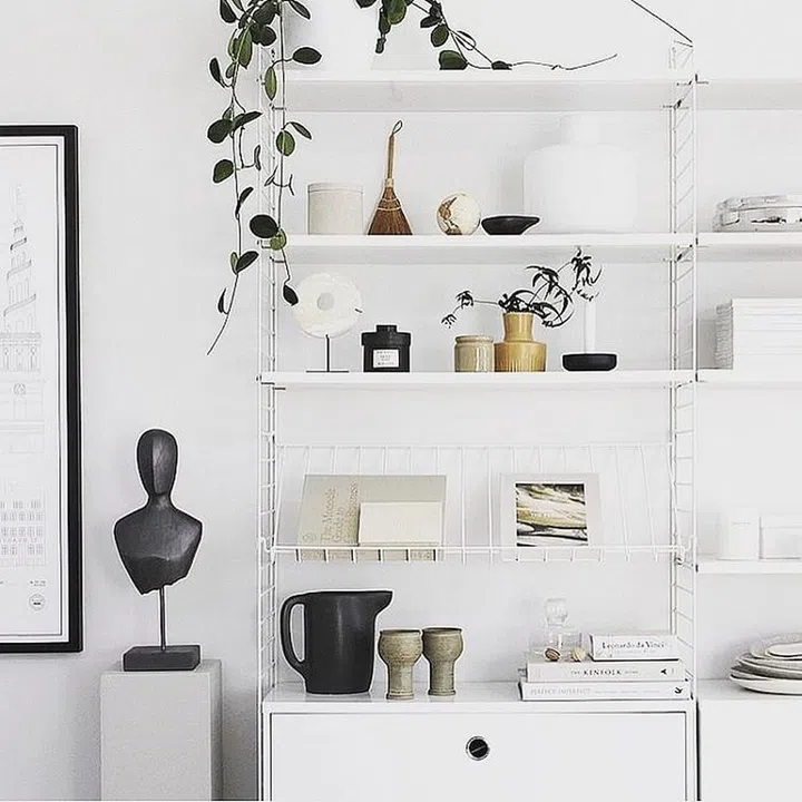 If you don't have the space to go sideways, go upwards! Your room doesn't stop at eye level – make the most of the whole wall space and introduce some high shelving. Display framed prints, books and metallic accessories or even designer shopping bags that can be displayed and bonus, used for hidden storage. As well as providing a practical out-of-the-way storage solution, this draws the eye upwards to another area of the room, highlighting the extra space. Photo: Instagram