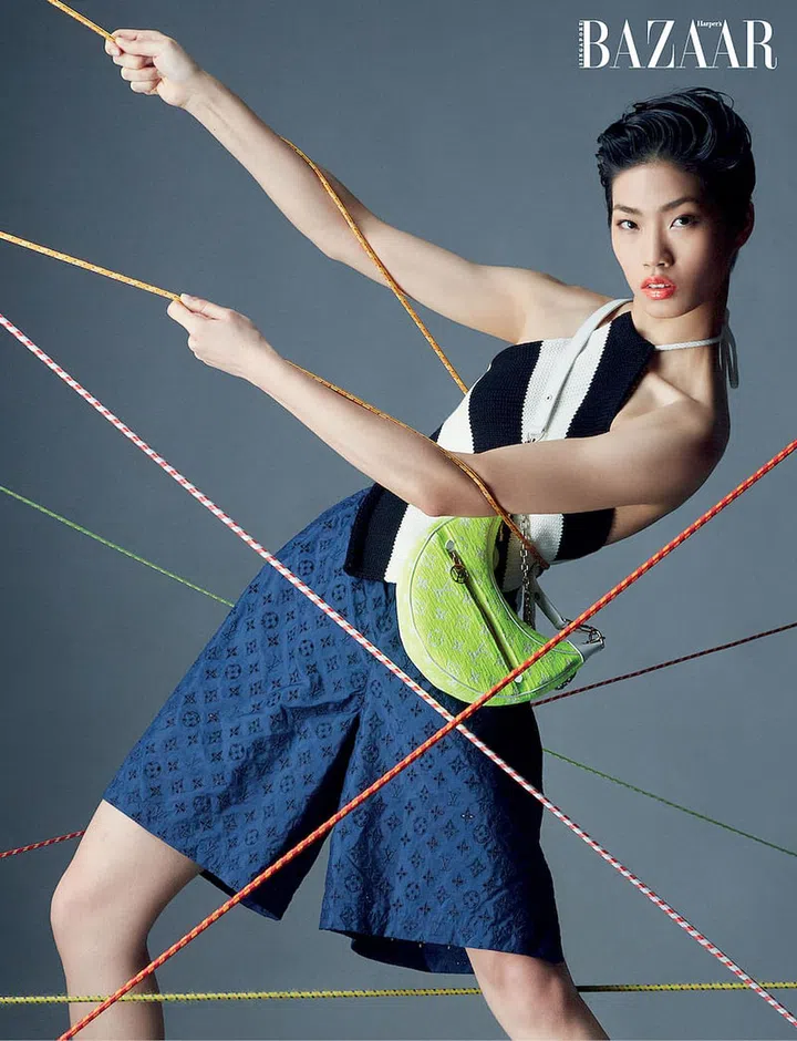 Cotton‐blend pullover; matching shorts; leather flatform sandals, all from Louis Vuitton. Socks, stylist’s own. (Photo: Gan)
