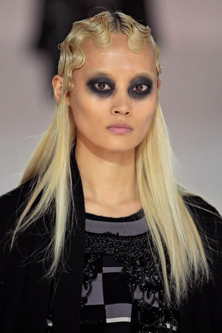 There is always a distinctive beauty look at Marc Jacobs and for autumn/winter 16, it was very strong: dark, smoky eyes, teamed with Twenties-style Marcel waves.