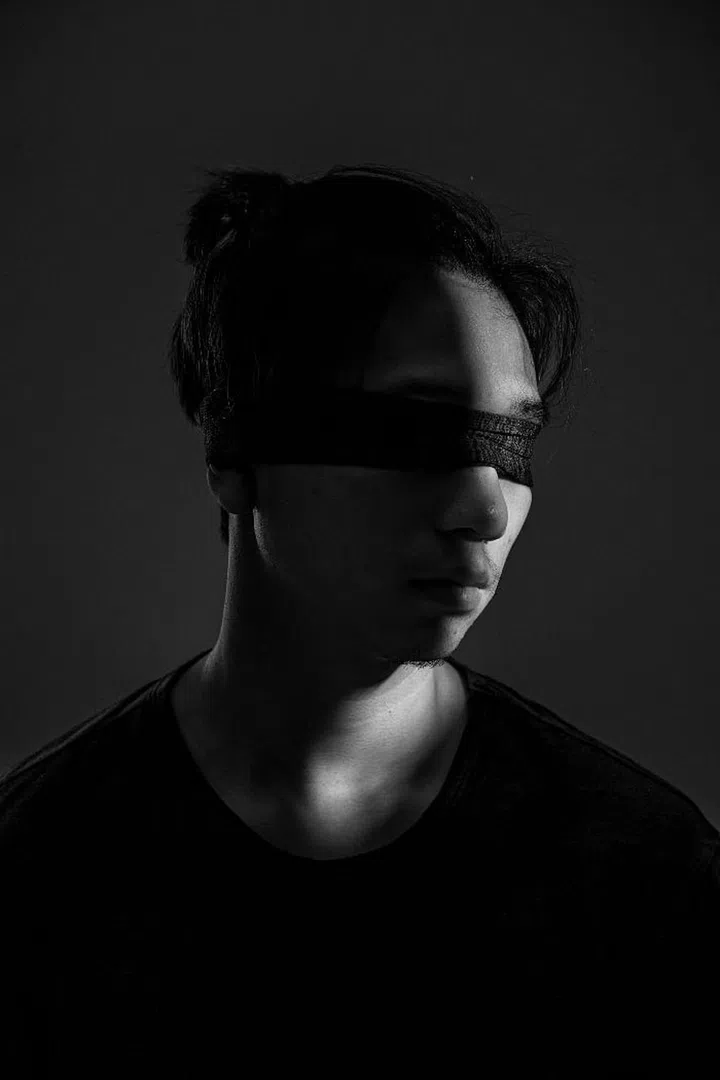 This image displays a 20-year-old male student from Yau Tsim Mong as he stands for a portrait at a studio in Chai Wan, Hong Kong. Since June, pro-democracy protesters have flooded the streets of Hong Kong, furious with the territory’s Beijing’s-backed government which refuses to concede to democratic reforms. 