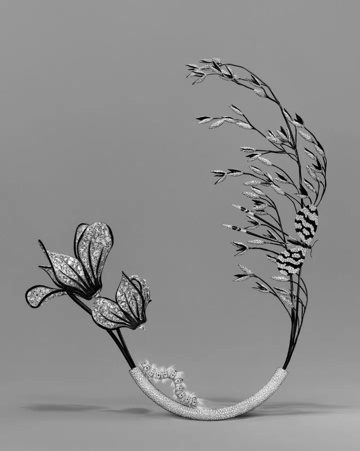 This Boucheron Carte Blance Impermanence Composition No. 4 is in the shapes of cyclamens, oat, caterpillar, and butterfly with black-coated titanium, white gold and 700-rose cut diamonds to form a virtual stained-glass window of diamonds that takes 4,279 hours of work.