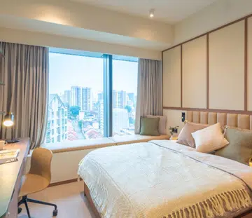fully furnished bedroom in weave living hillside serviced apartment in singapore