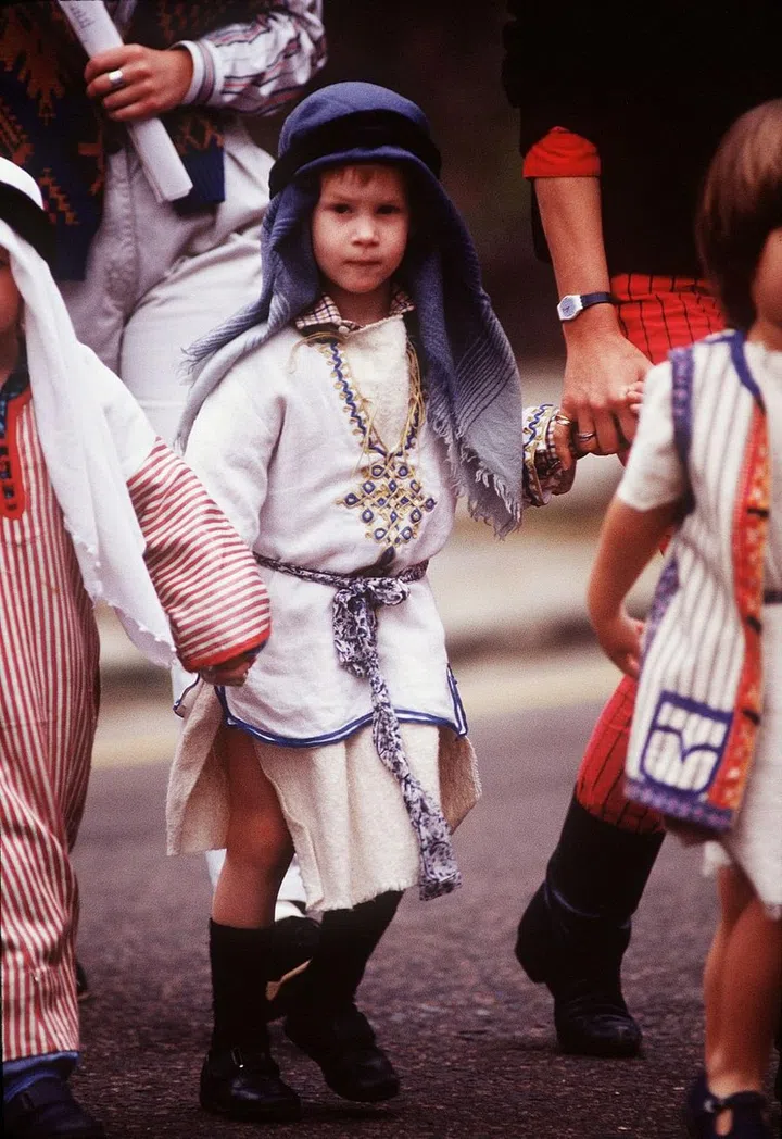 Prince Harry, 4, dresses as a shepherd for the Christmas play in his school.