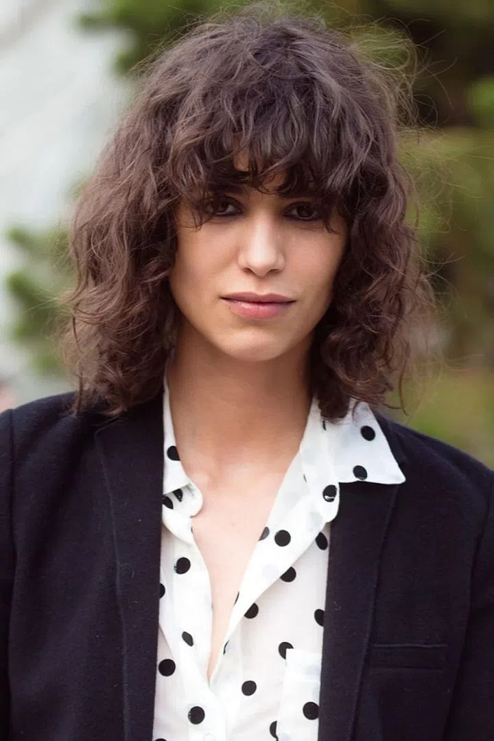 The model and her tousled curls are helping to bring individuality to the runway. Photo: Getty