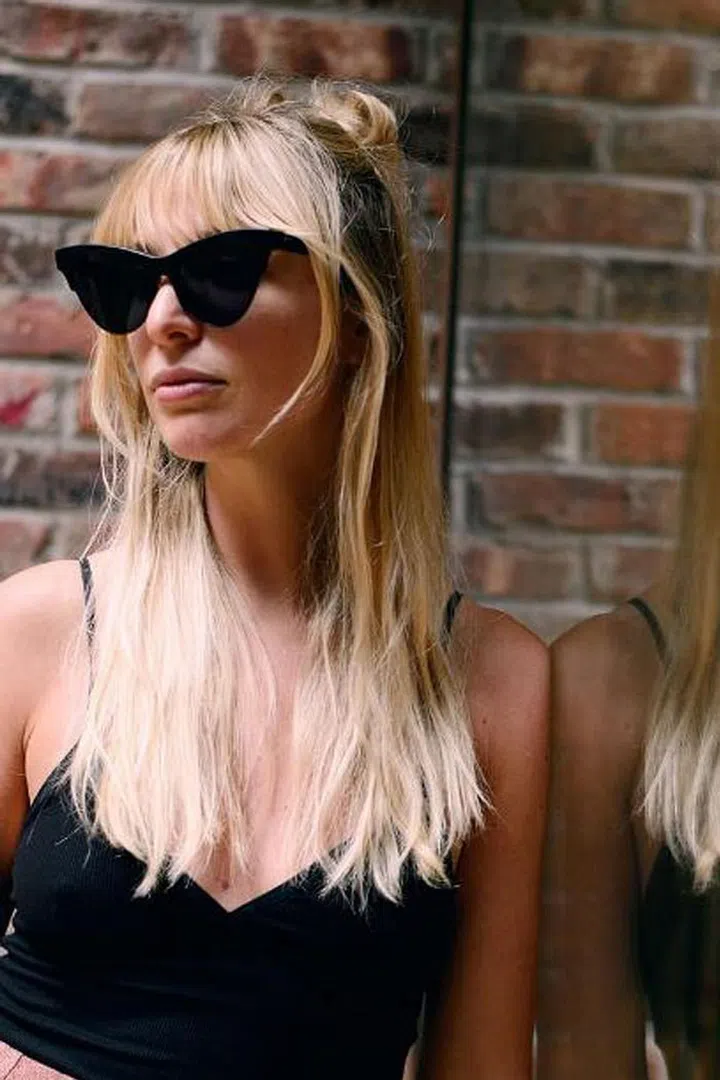 Showing your stylist a picture of Brigitte Bardot's bangs is never a bad idea. The face-framing layers look best when your hair falls past your shoulders. Photo: Instagram @kerrybazaar