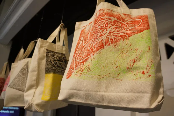 Odyssey's preschoolers display their artistic talent on plain recycling bags.