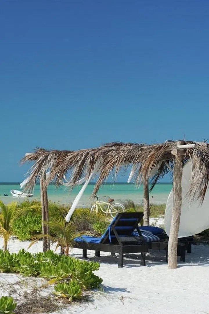 Located off of the Yucatan Peninsula, visitors have to take a ferry or boat to this Nature Preserve. Once you're there, you'll feel like you went back in time, as the tiny island doesn't have cars (only golf carts), ATMs or popular chains. Photo: Getty 