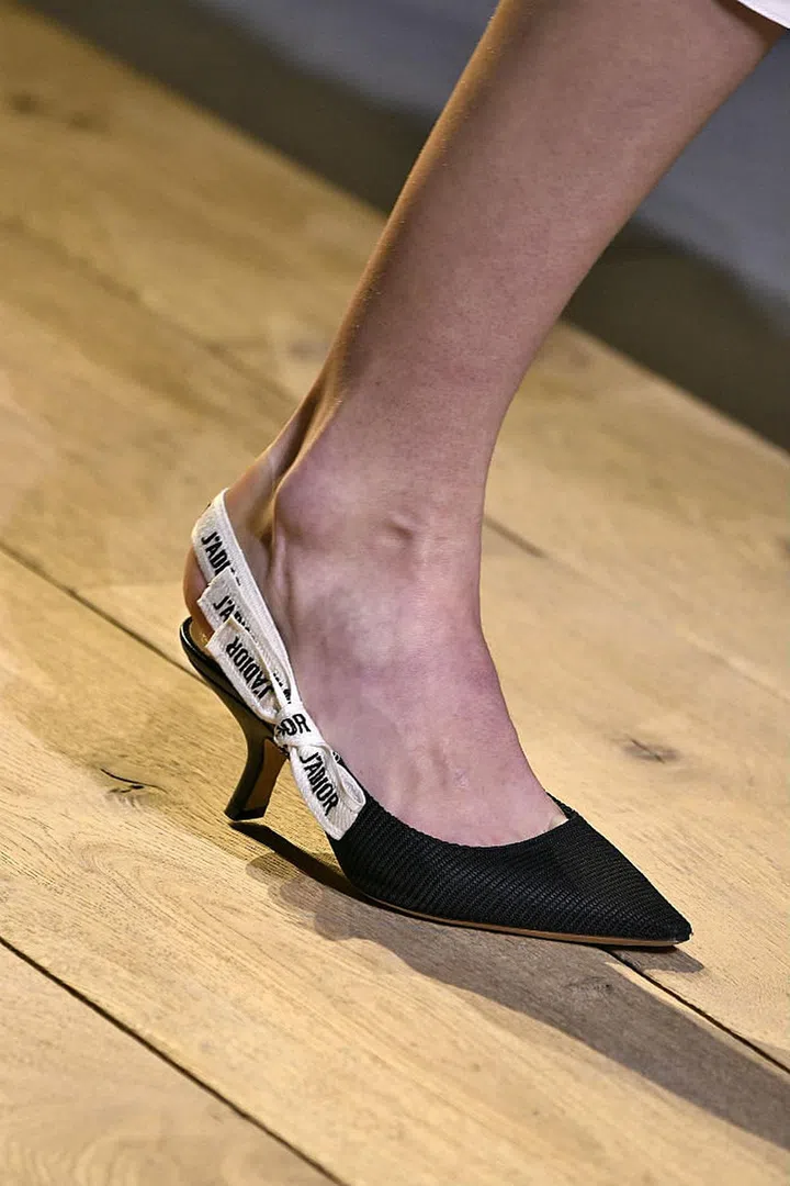 Seen in: Paris Fashion Week SS17 // Reason to love: Time and again, Dior champions elegant designs with aplomb. So we were thrilled to see Maria Garzia Chiuri putting together a pointed-toe kitten heel with an adorable "J'ADIOR" printed bow, which are all the design details an ultra-feminine pair of shoes should ever have (Photo: Getty)
