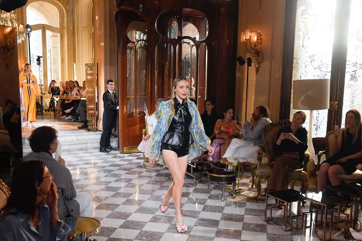 The model and actress stuns in leather shorts for Miu Miu.

Photo: Getty