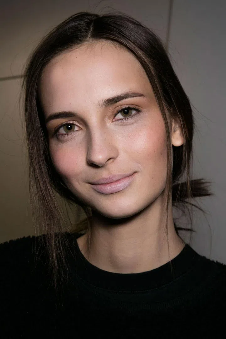 Soft pinks were seen at Derek Lam, too. While the make-up was pretty and feminine, the hair was fastened in a quick, undone knot.